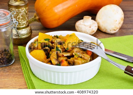 Baked Pumpkin with Mushrooms and Vegetables. Vegetarian Food. Studio Photo