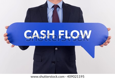 Businessman holding speech bubble with a word CASH FLOW