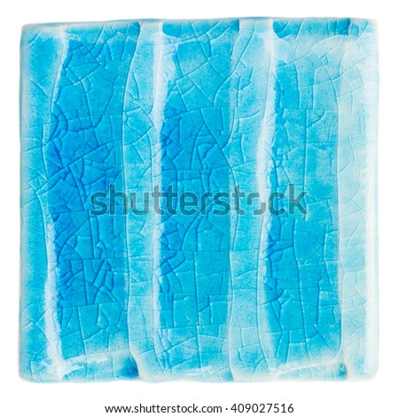 Blue lined handmade glazed ceramic tile isolated on white background