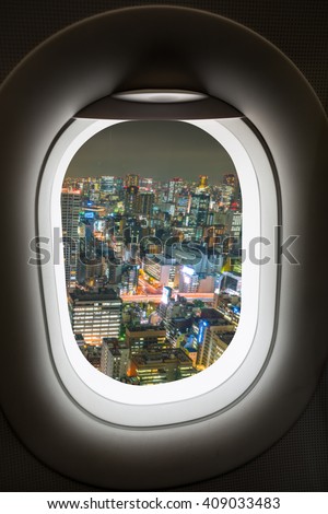 Window plane with view of cityscape