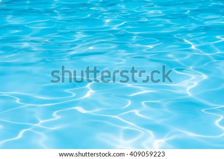 Beautiful Gentle wave in swimming pool with sun reflection