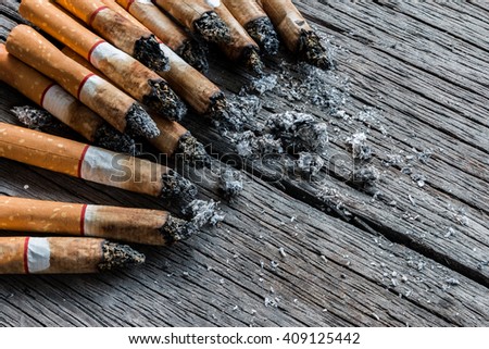 Cigarettes closeup on wood background texture with copy space