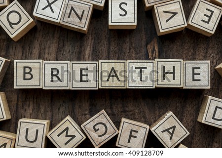 the word of BREATHE on building blocks concept