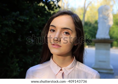 Portrait of beautiful girl in the park