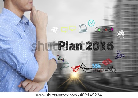 young man stand and thinking with plan 2016  text ,business concept 