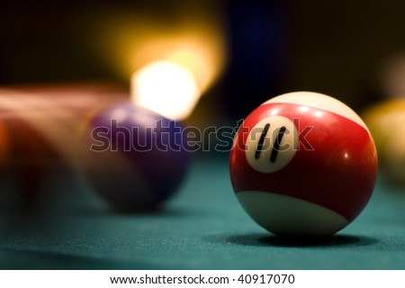 Billiard balls in motion on a pool table