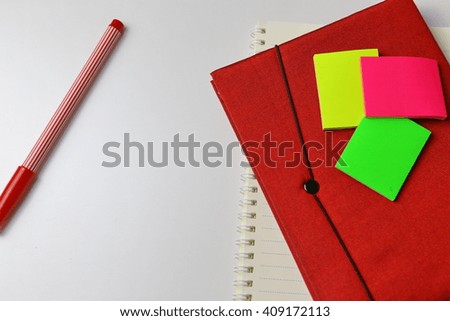 Laptop and Notepad on wooden surfaces