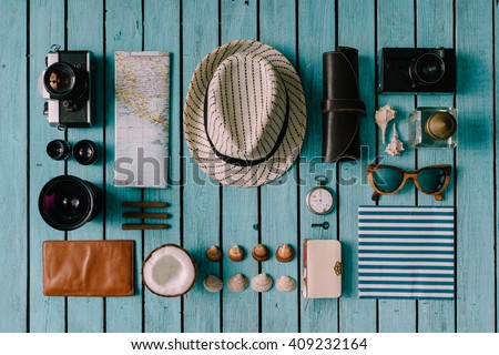 Summer vacation things neatly organised. Travel concept. Flat lay. Royalty-Free Stock Photo #409232164