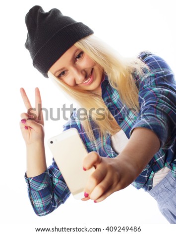 pretty teen girl wearing hat, taking selfies