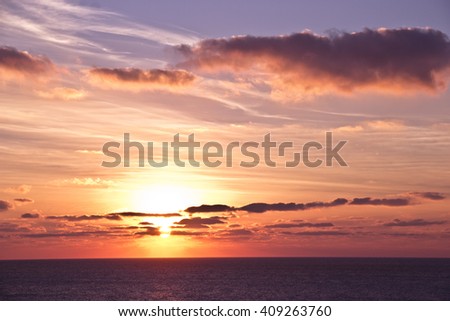 Sunset with Clouds in Ericeira, Portugal Royalty-Free Stock Photo #409263760