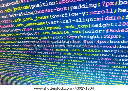 Writing program code on computer.  Website codes on computer monitor. Software background. Programming code abstract screen of software developer. Monitor photo. Programming code on computer screen. 
