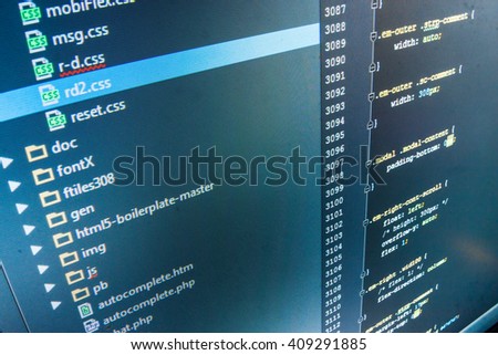 Software source code.  Website codes on computer monitor. Computer script.  Programming code. Developer working on software codes in office. Software background. Writing program code on computer. 
