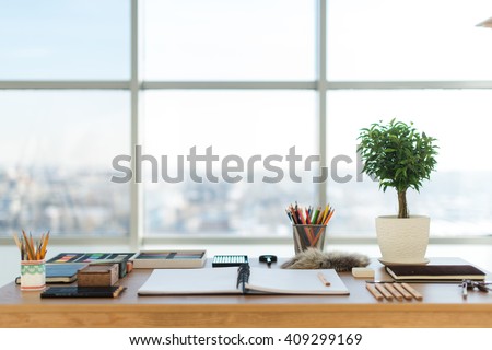 Artist workplace ready for pastel, drawing. Colorful pencils and crayons palette organized on the desktop Royalty-Free Stock Photo #409299169