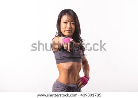 Sports woman pointing finger at camera

