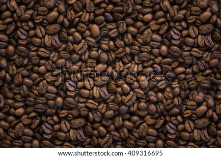 Background image of dark coffee beans filling the picture
