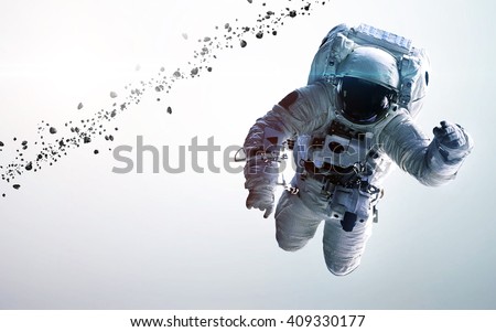 Astronaut in outer space. Spacewalk. Elements of this image furnished by NASA Royalty-Free Stock Photo #409330177