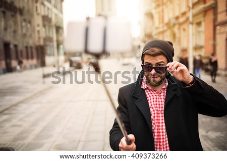 Hipster man taking selfie