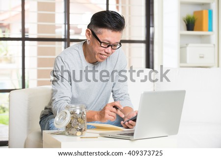 matured asian male with finance concept photo