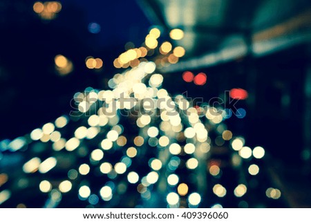 Artistic style - Vintage style, Defocused urban abstract texture bokeh city lights & traffic jams in the background with blurring lights.