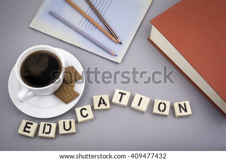 Text: Education from wooden letters on a gray desk