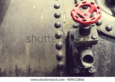 detail of an old locomotive flywheel; vintage filter effect