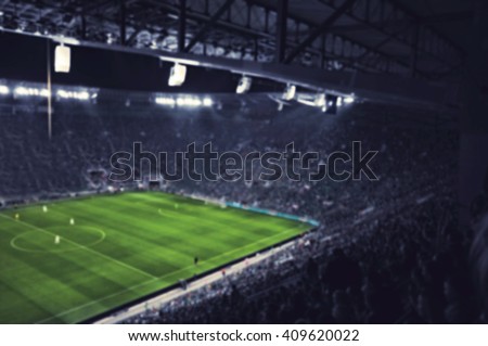blurred football stadium Royalty-Free Stock Photo #409620022