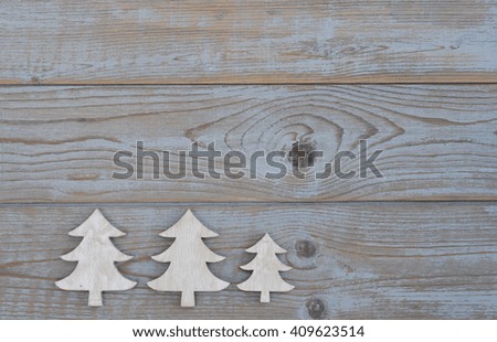 White christmas decoration as christmas tree on a old grey wooden planks background with empty copy space