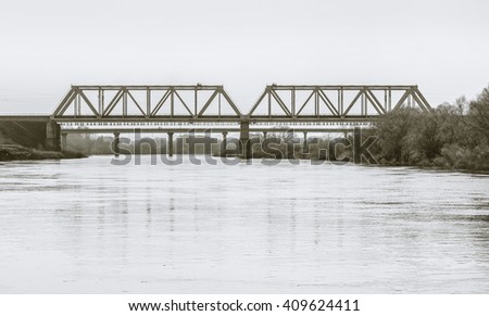 Bridges over river Ugra. Kaluga region, Russia. Black-and-white in light tinting Royalty-Free Stock Photo #409624411