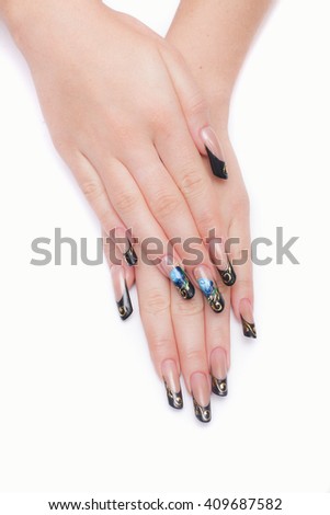 Closeup photo of a beautiful female hands with nail design in the Russian style. Isolated on white background