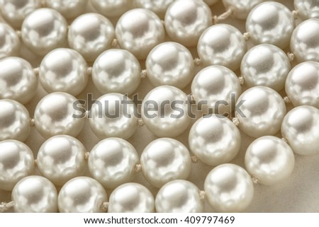 String of white pearl as background in closeup