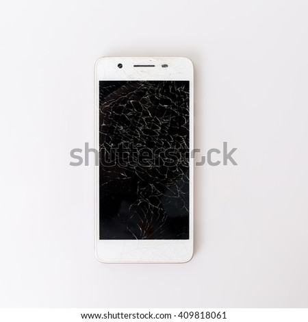 close up of broken smartphone on white background.