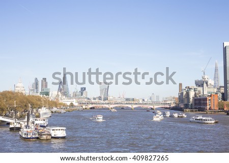 Cityscape skyline with St. Paul Cathedral and the financial district of the City on the Thames River in London, Uk.