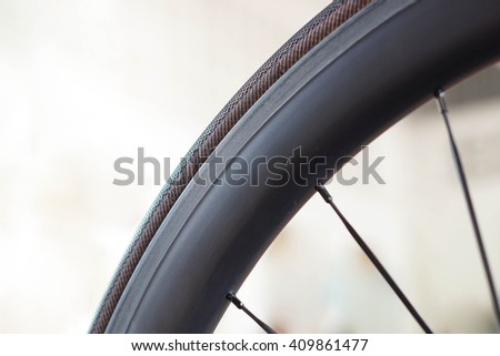 Road bike wheel and tire made from carbon