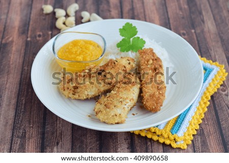 Chicken fingers breaded with cashew nuts and coconut flakes. Served with mango dip and steamed rice
