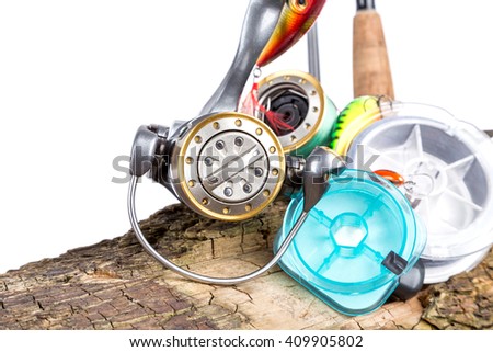 fishing tackles and fishing baits on wooden background. Idea for angling sport business - templates, web, poster, card, advertisement.