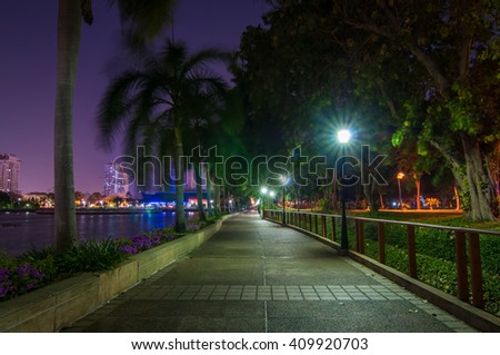 Slow speed shutter with walkway in the park at night.Bangkok Thailand