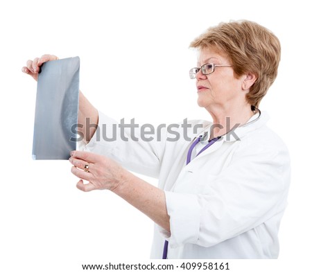 Senior Caucasian woman a doctor looking an X-ray picture, isolated on white background