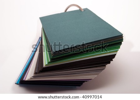 Colored paper stock stand on white background
