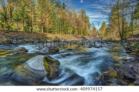 A River Runs through the Cascade Mountains just outside of Seattle, Wa on an Early Spring Day