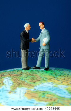 Two managers on a globe. Globalization