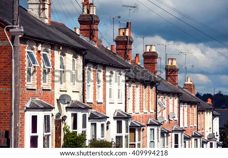 Row of Typical English Terraced Houses Royalty-Free Stock Photo #409994218