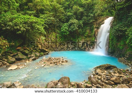 The Rio Celeste waterfall in Costa Rica Royalty-Free Stock Photo #410034133