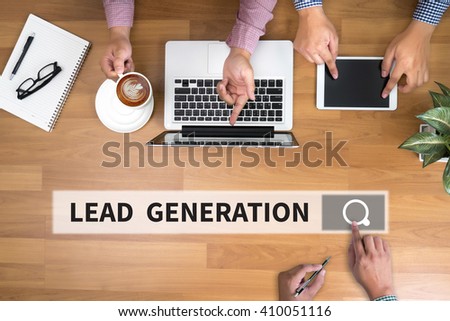 LEAD GENERATION man touch bar search and Two Businessman working at office desk and using a digital touch screen tablet and use computer objects on the right, top view