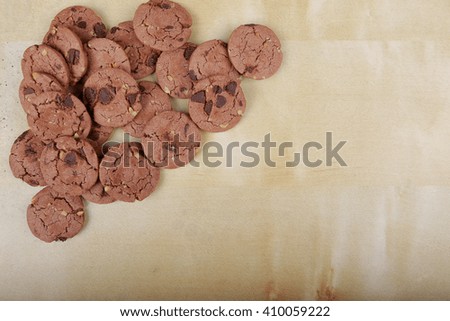 Traditional chocolate chip cookies with peanut on plain wooden table. Space for text. View top.