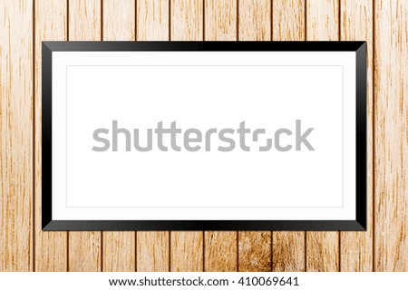 Blank billboard frame on wood wall