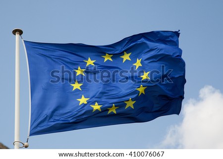 The EU European flag at the blue sky