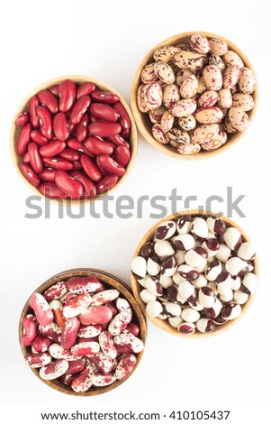 Four kinds of beans on white background. Top view
