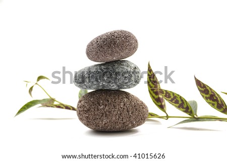 Spa stones stacked in perfect balance with leaf