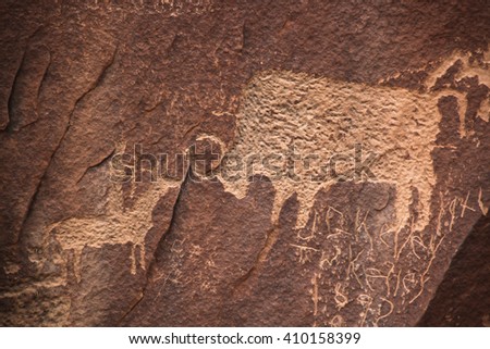Prehistoric pictures of buffalo on stone with desert varnish, from Native American artist on Newspaper Rock Utah