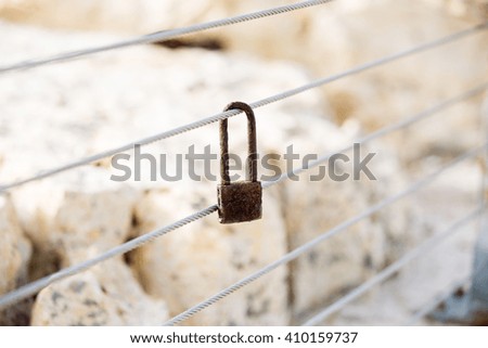 lonely old rusty padlock